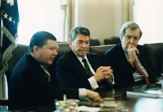 President_Ronald_Reagan_receives_the_Tower_Commission_Report_with_John_Tower_and_Edmund_Muskie.jpg